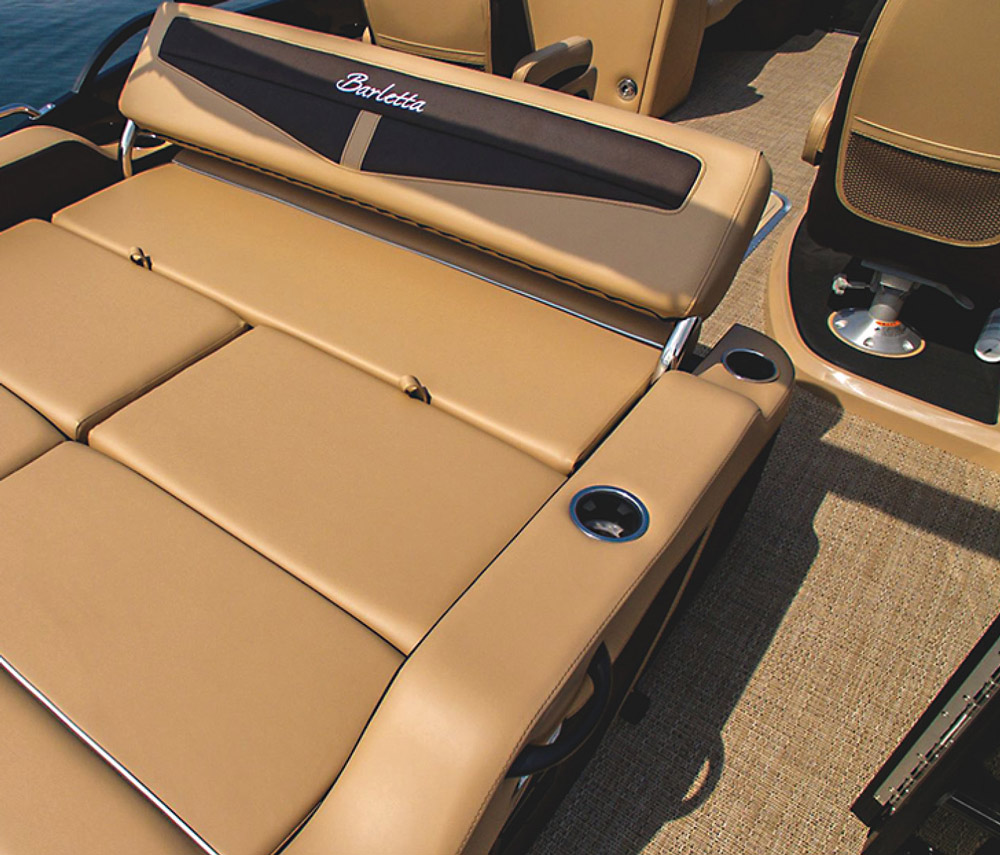 Landscape close-up photograph view of the Barletta Cabrio C22UC pontoon motorboat vehicle's passenger lounge couch seating area with cupholders equipped