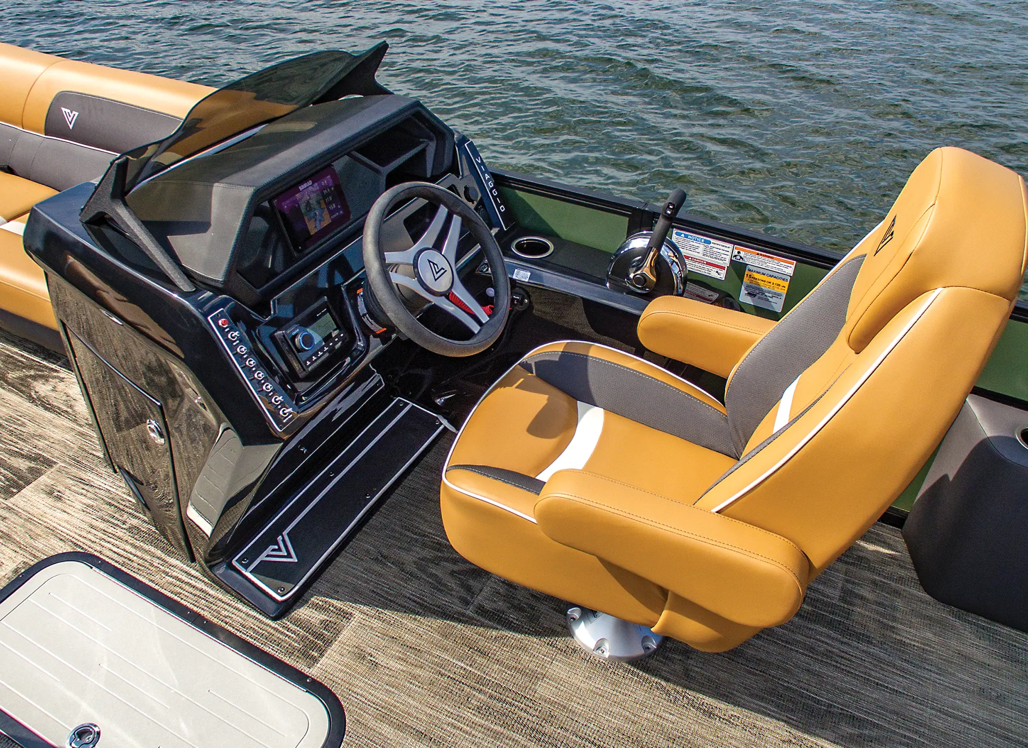 Landscape close-up angle photograph view of the Viaggio Lago X24S pontoon motorboat vehicle's driver seat area