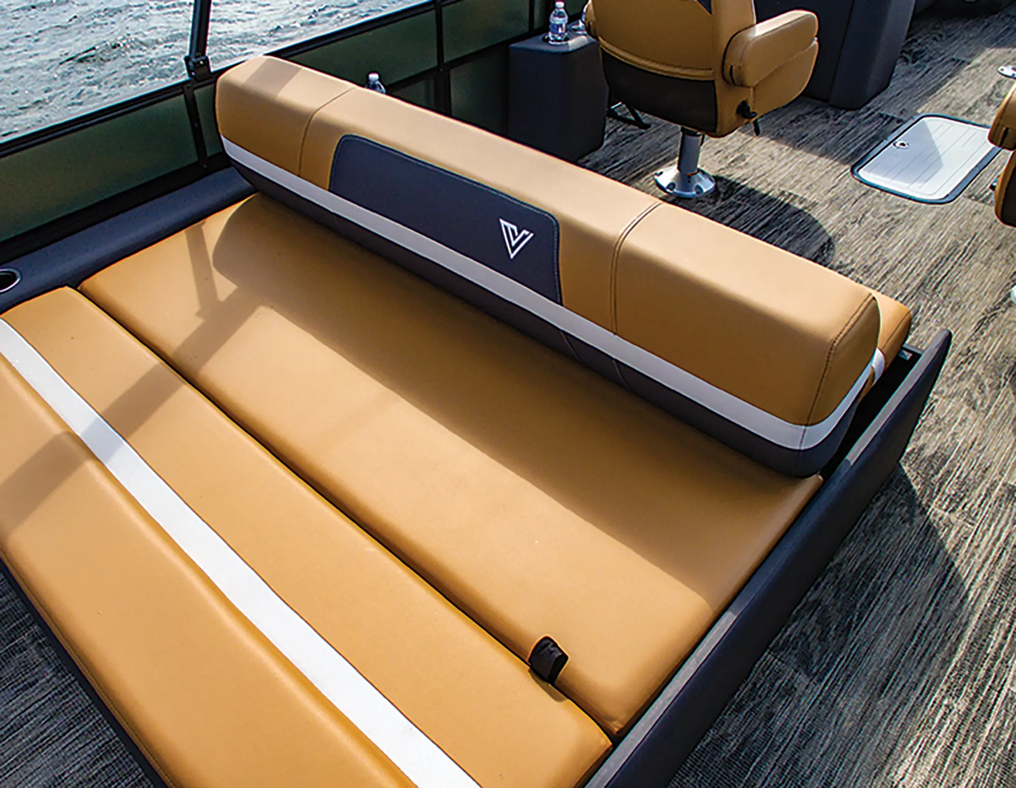 Landscape close-up angle photograph view of the Viaggio Lago X24S pontoon motorboat vehicle's passenger lounge couch area