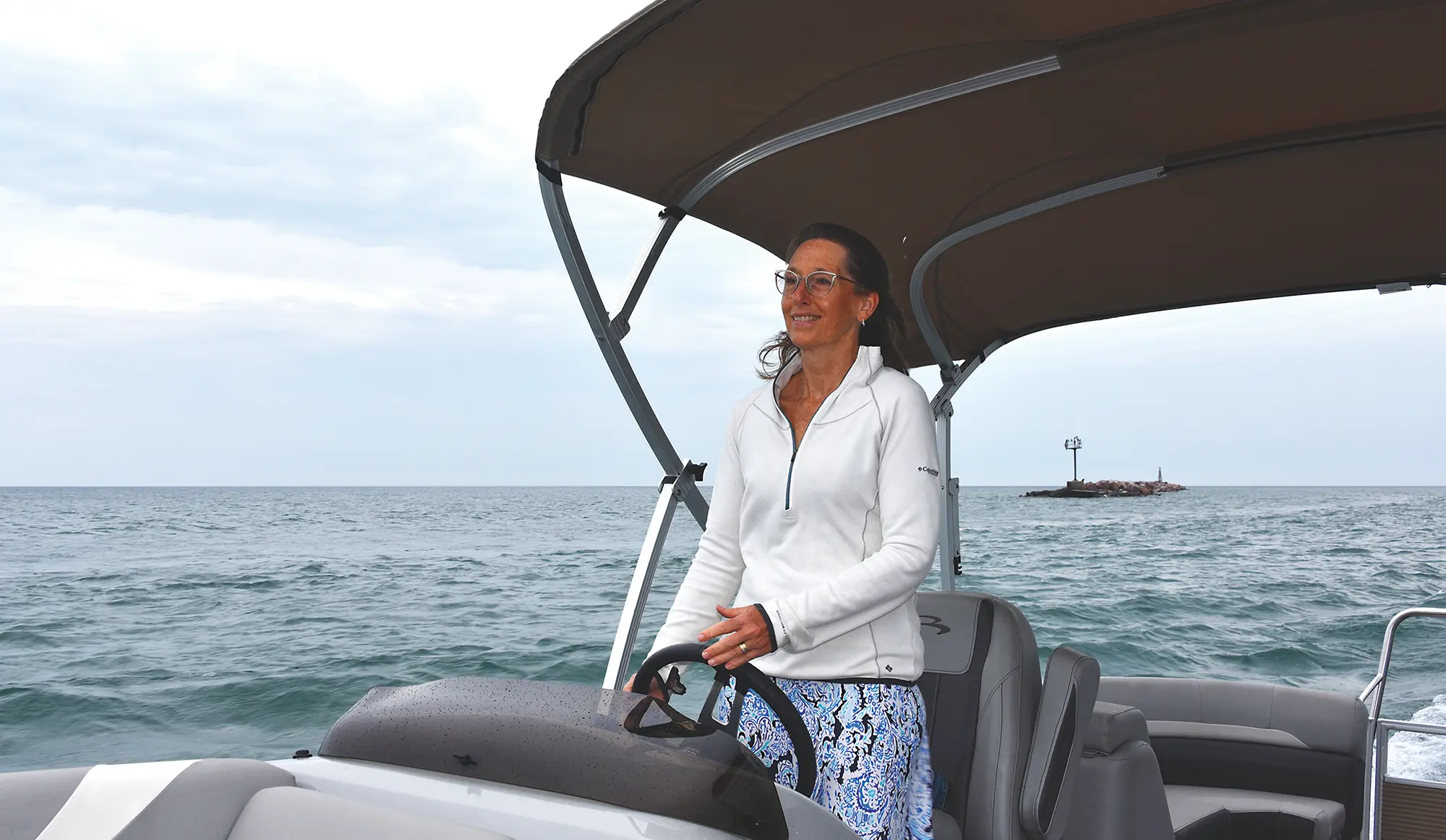 Teresa Hunt driving a boat
