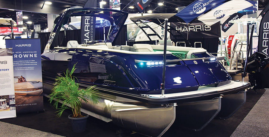 dark blue pontoon being displayed in a showroom