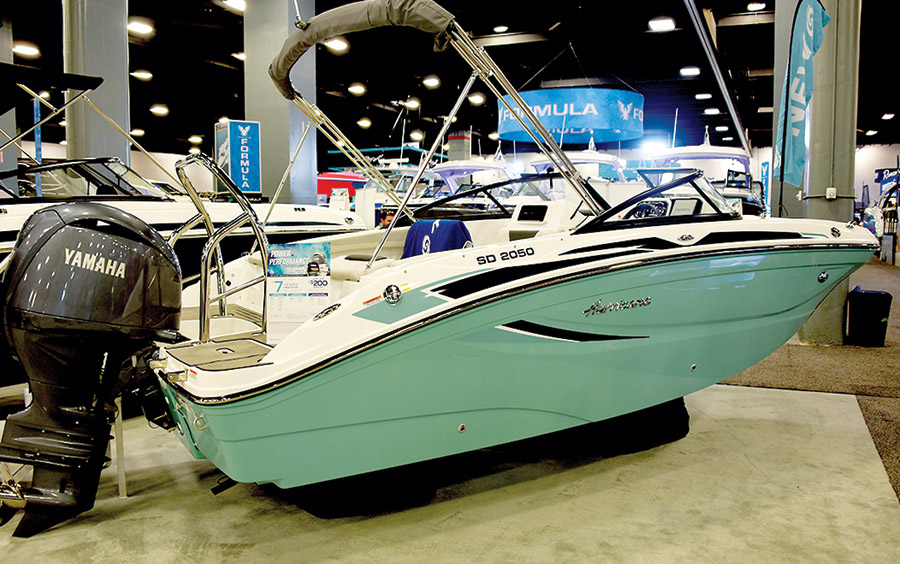 green and cream colored SunDeck 2050 boat