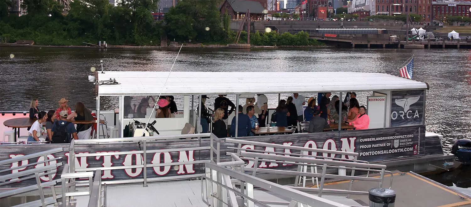 group of people on the Pontoon Saloon
