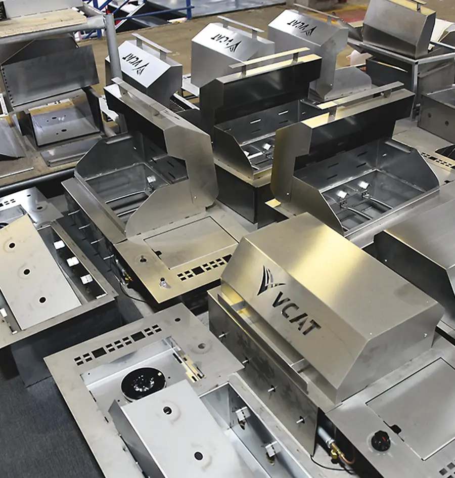 a large grouping of VCAT in-house built barbecue grills