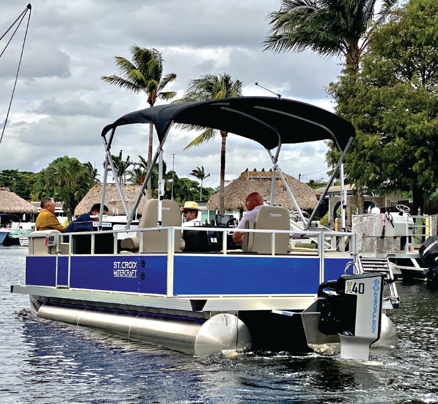 ePropulsion boat in the water with 4 men inside