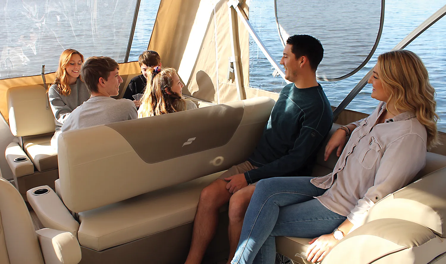 family sitting on a boat