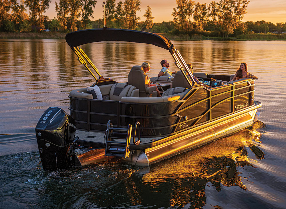 people on a boat at sunset