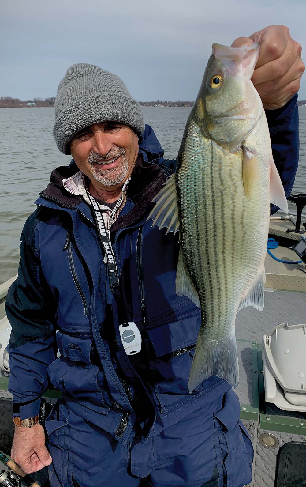 man holding a wiper fish