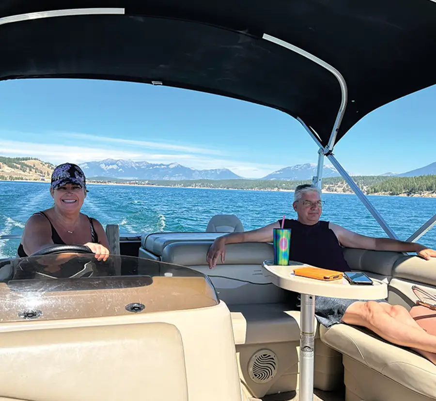 woman and man relaxing in the shade on a pontoon