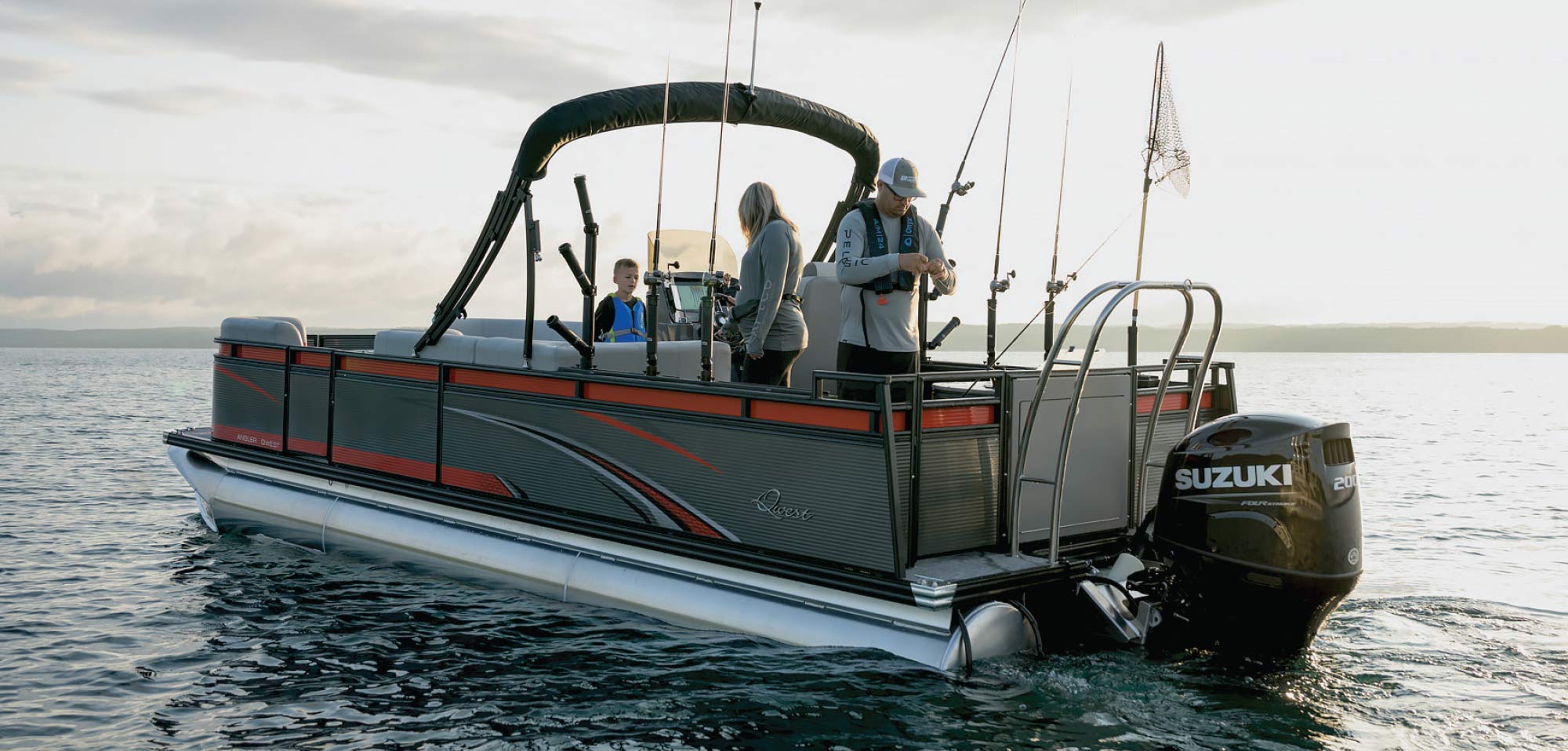 couple and their child on Qwest pontoon