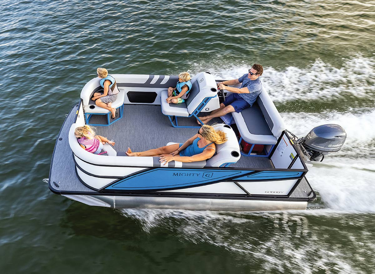 family of man, woman, and three kids sitting on Godfrey Mighty G Cruise moving through water