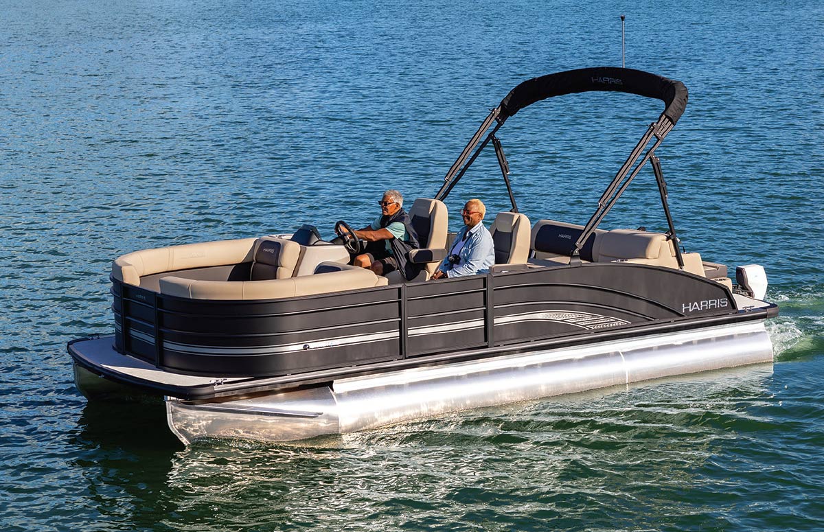 two men driving Harris Cruiser E-210