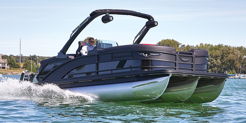 black and silver Bennington 22 MSB pontoon in the water