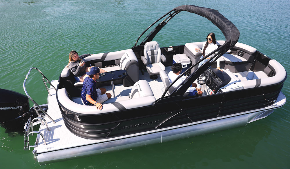 black and white Berkshire 22RFX CTS pontoon in the water