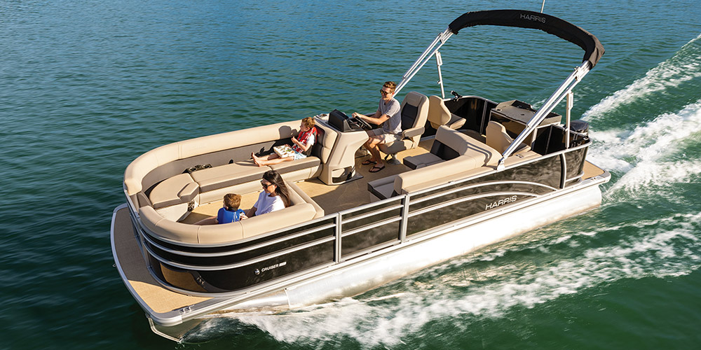 brown and white Harris Cruiser 230 pontoon in the water