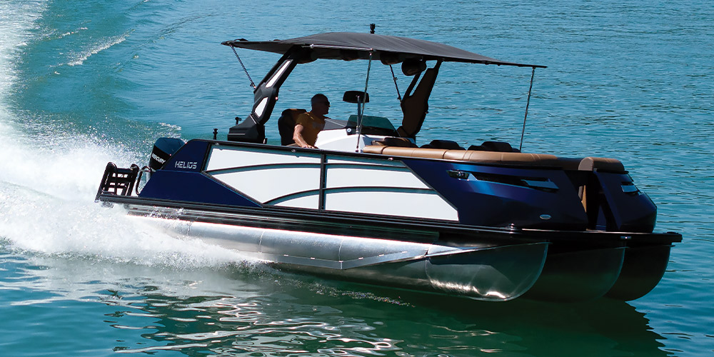blue and white Helios GT-R 23 pontoon in the water