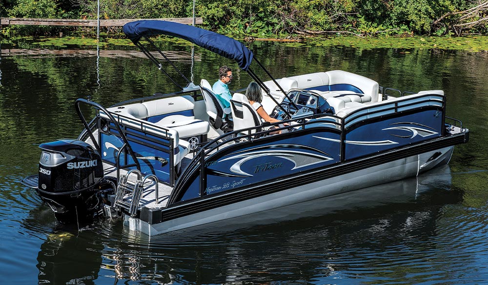 blue and white JC TriToon NepToon 23TT Sport pontoon in the water