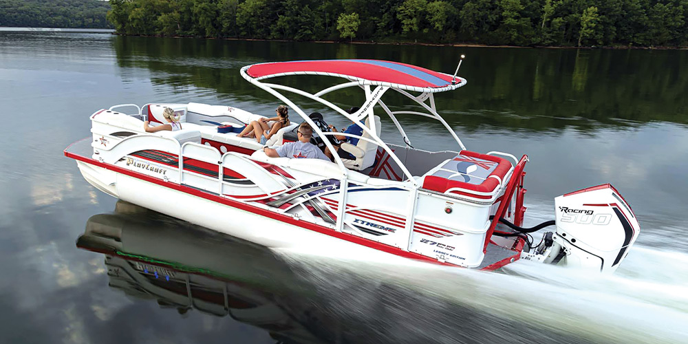 red and white PlayCraft PowerToon X-treme pontoon in the water