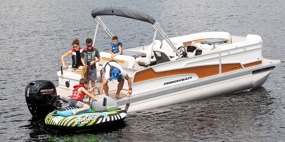 white and orange Princecraft Vectra 23 RL pontoon in the water