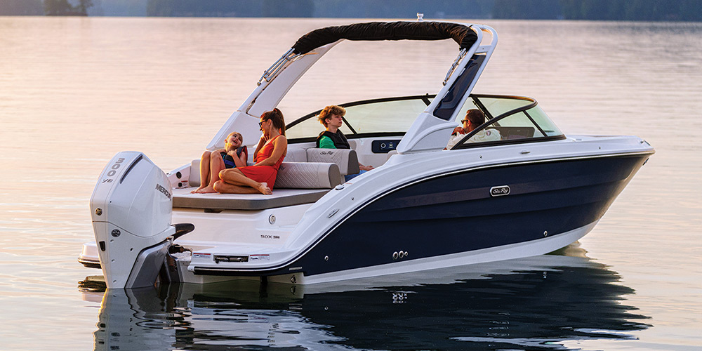 black and white Sea Ray SDX 250 Outboard in the water