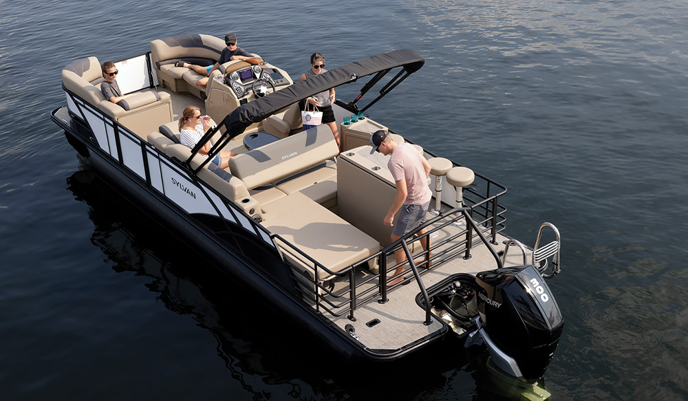beige and white Sylvan L3 DLZ Bar pontoon in the water