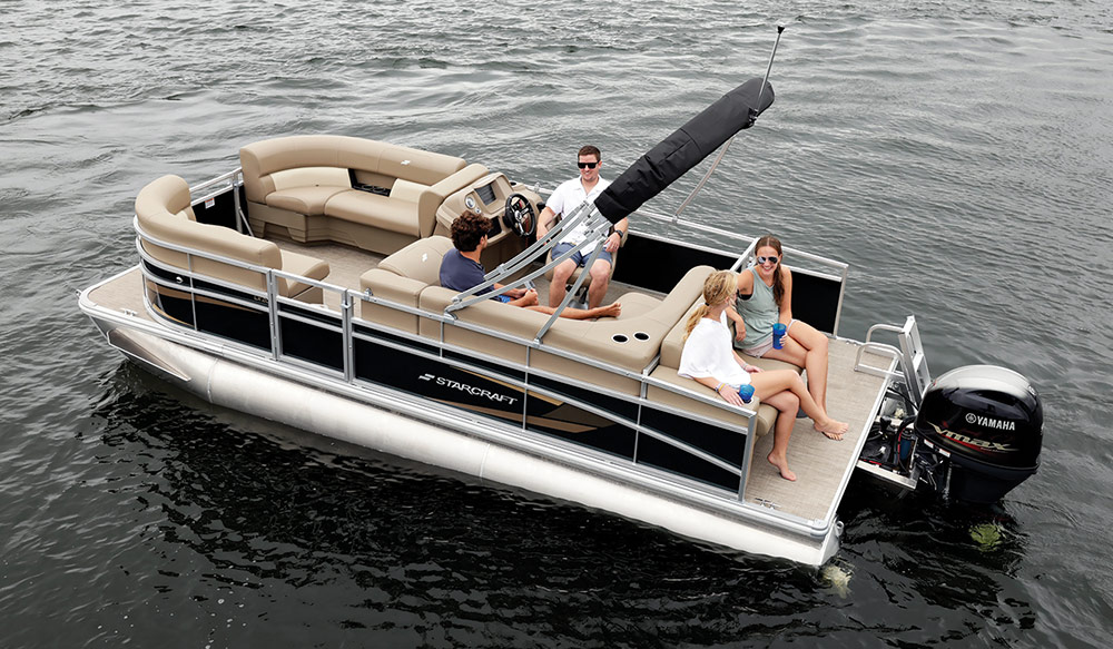beige and black Starcraft LX 20 CB pontoon in the water