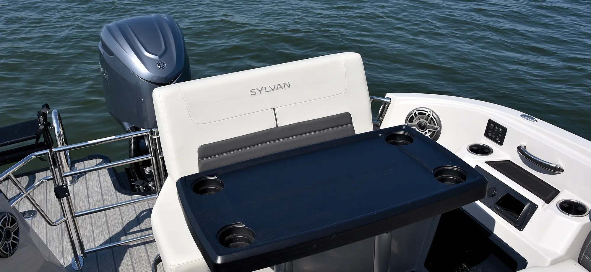 seat and table on a Sylvan pontoon