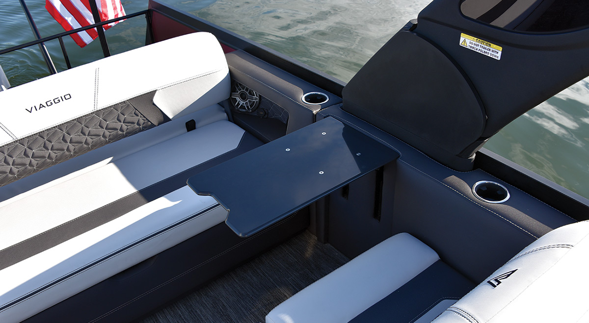 seats and side table on a Viaggio Diamante pontoon
