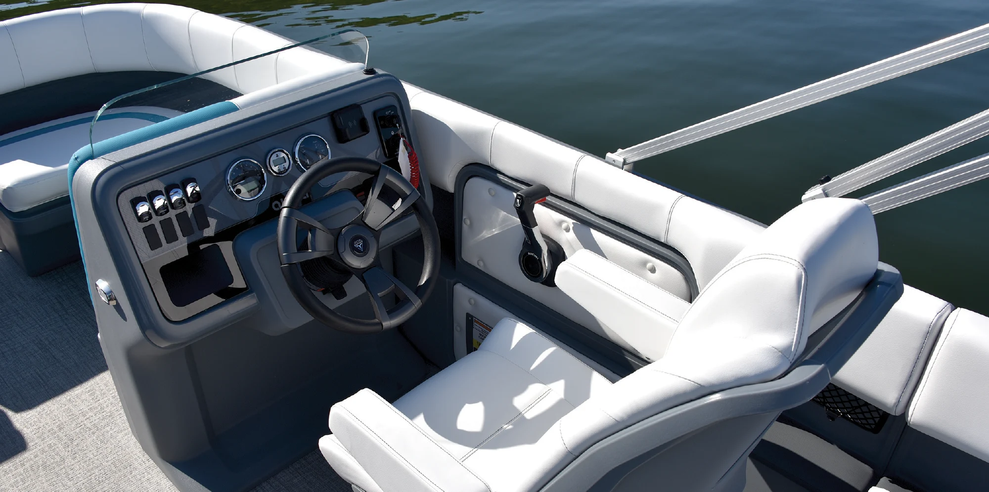 driver's seat of Aura Quad Lounge pontoon