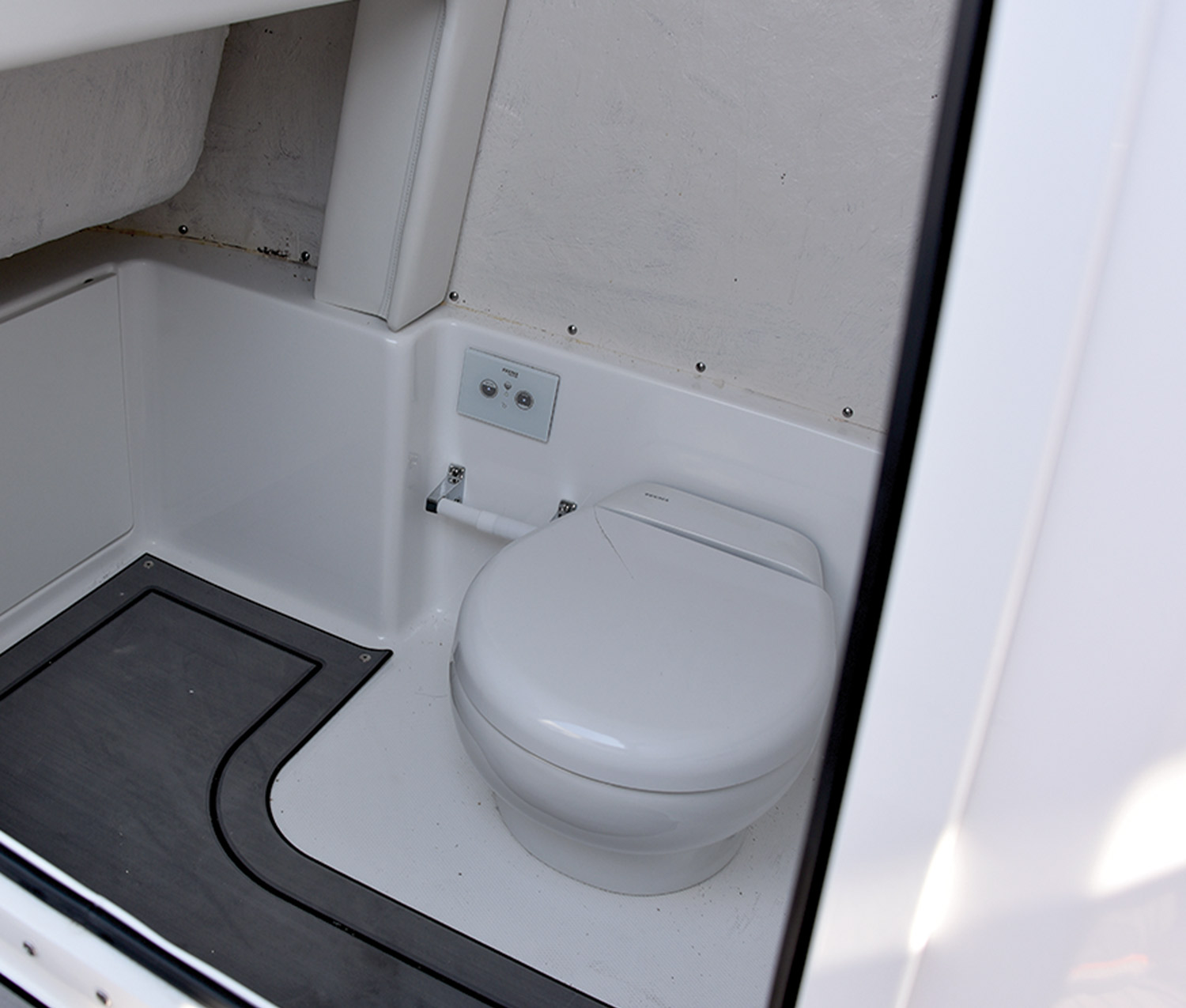 the Electric Flush Head of the of the Hurricane 24 Center Console pontoon