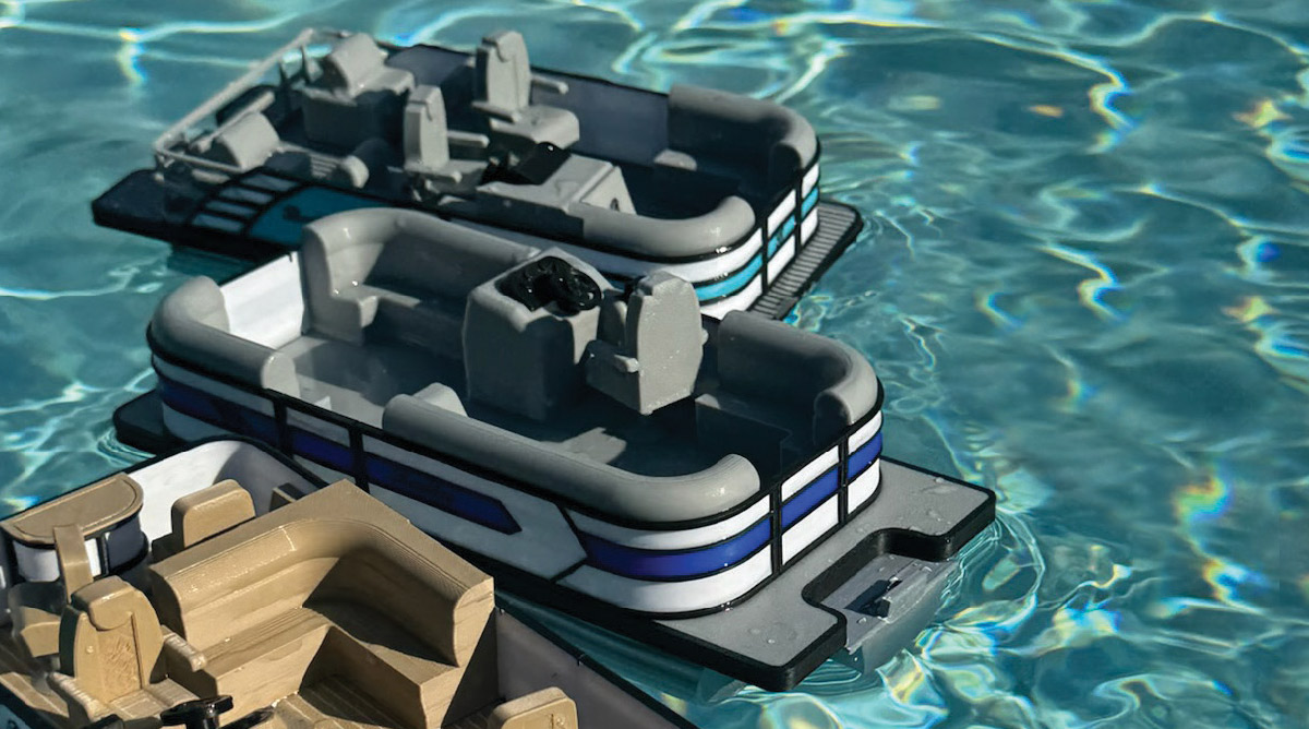three miniature pontoons floating on water