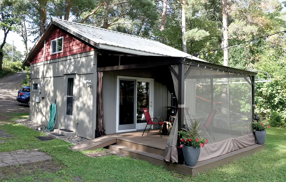 a small cabin like structure with a covered patio