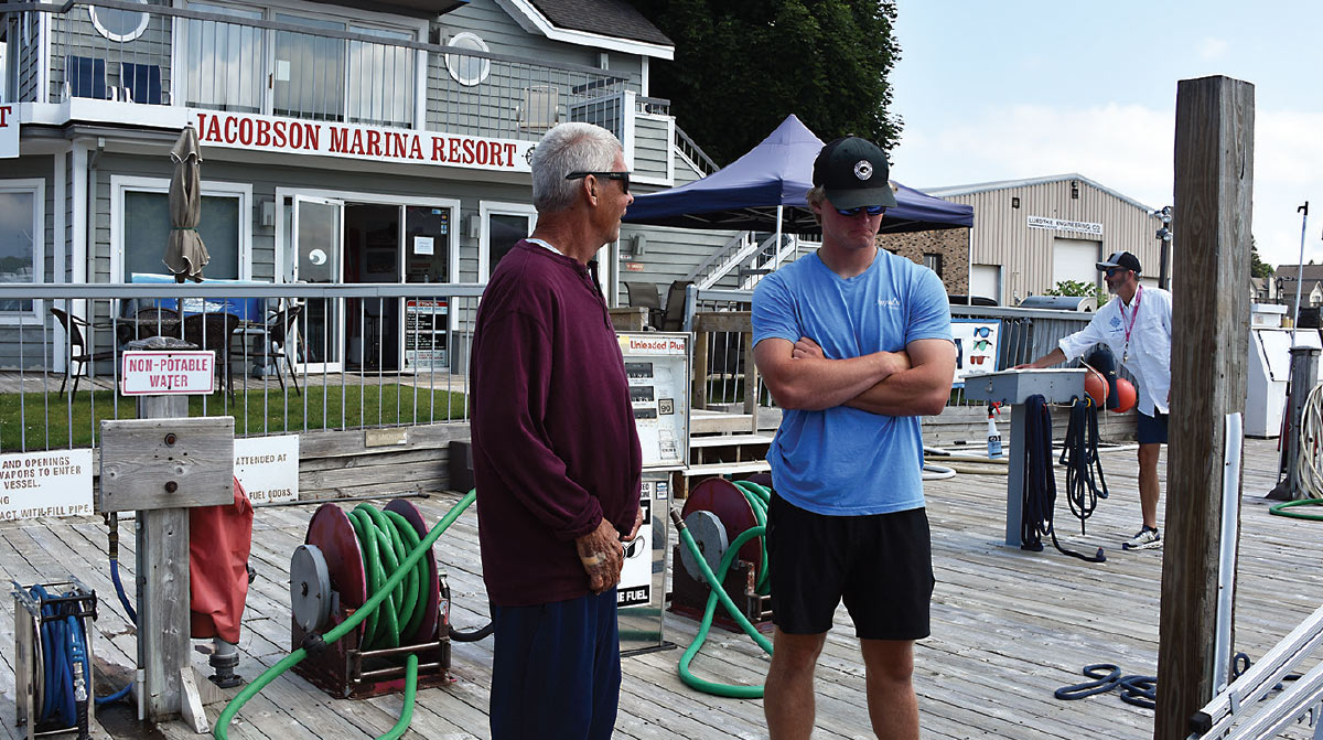 Goofy talking to employee on dock