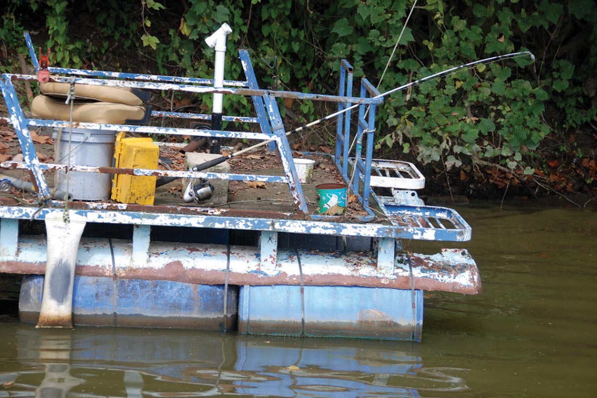 old rusty boat floating on water