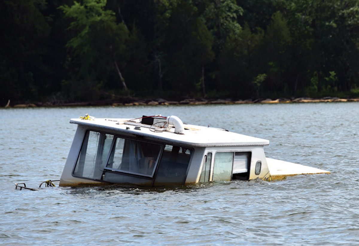 a partially submerged boat in water