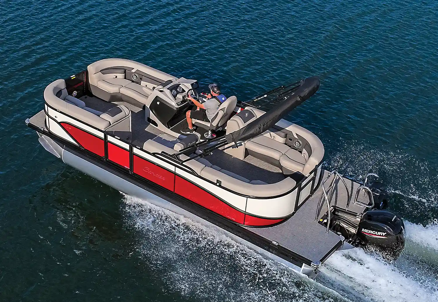 aerial view of a red and white MY2025 Barletta Cabrio pontoon in the water