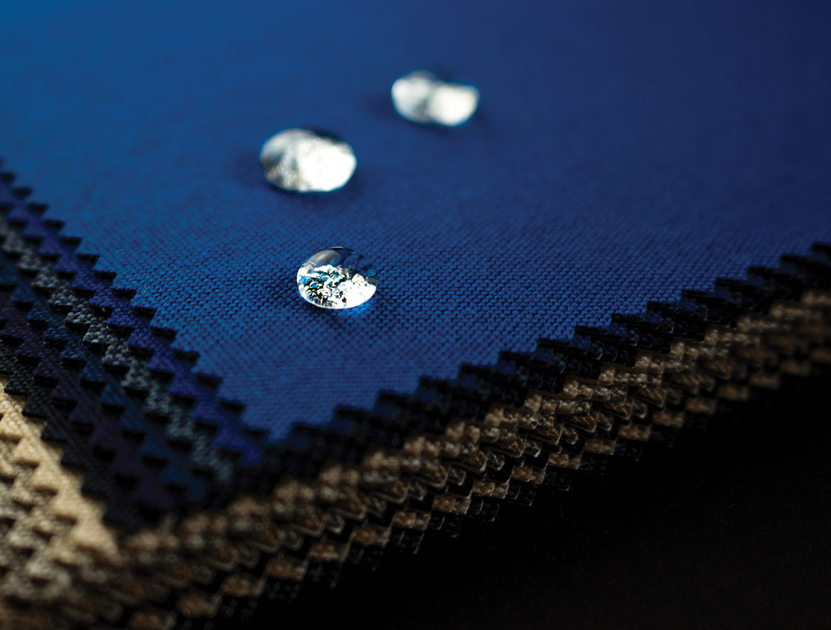 zoomed in view at three droplets of water resting on the Sunbrella’s highly water-repellent material