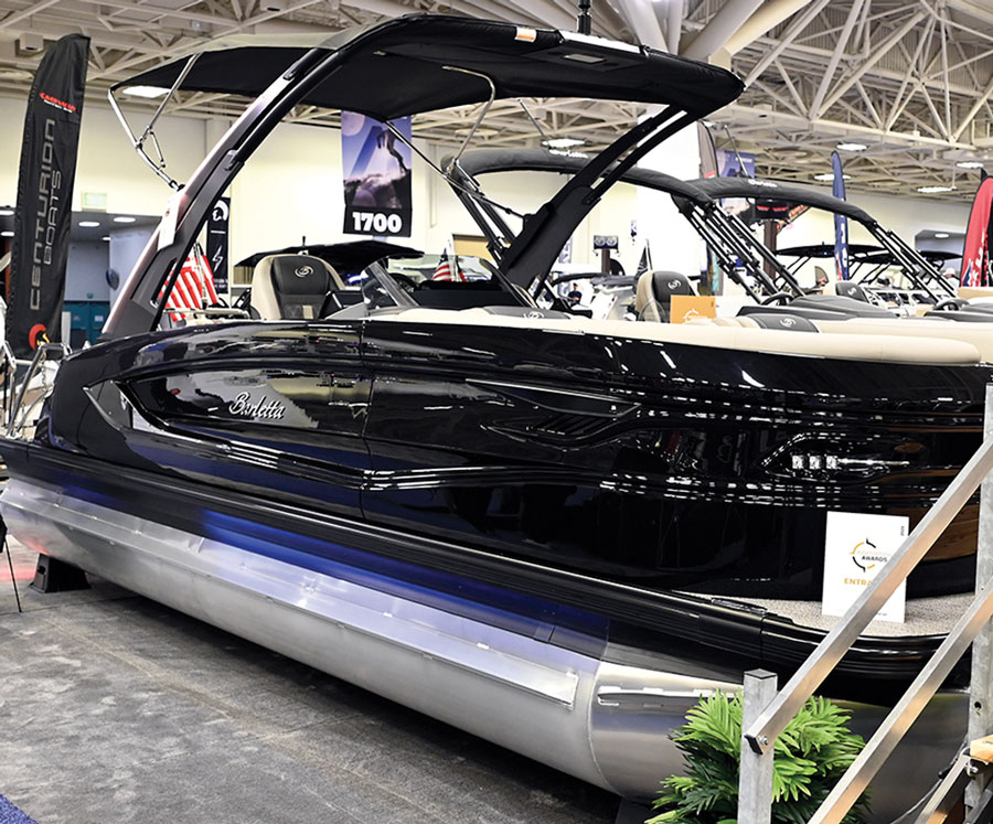 wide view of a Barletta pontoon with its addressable lights active while on a display floor 
