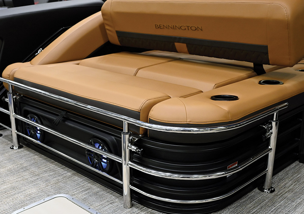a Bennington pontoon passenger bench featuring a disengaged retractable keeper rail