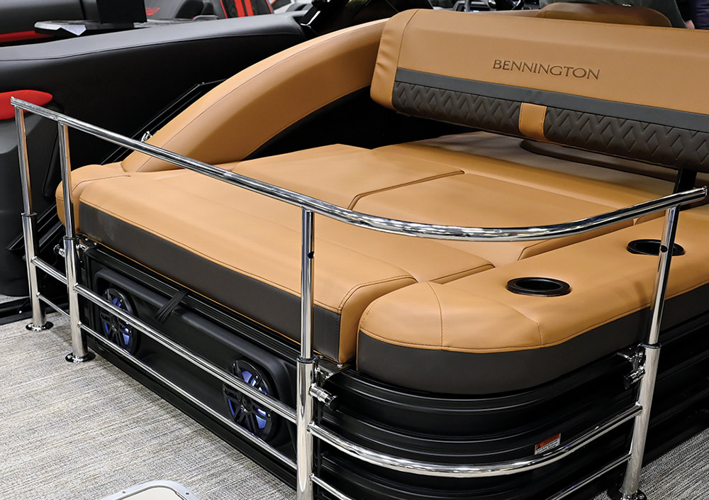 a Bennington pontoon passenger bench featuring an engaged retractable keeper rail