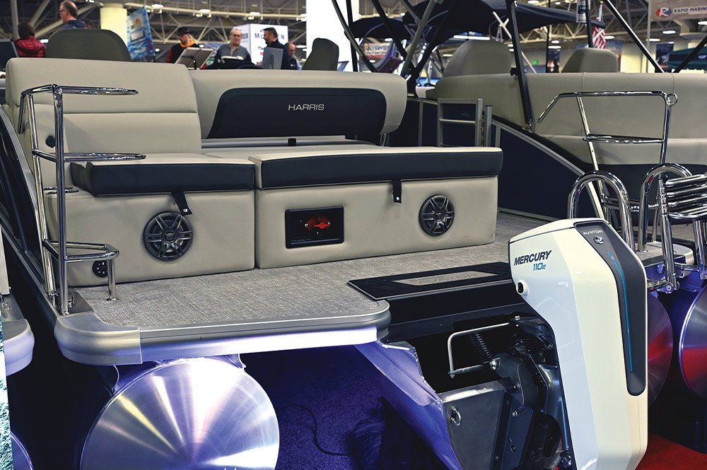 stern side view of a Harris pontoon on the NMMA Innovation Awards display floor