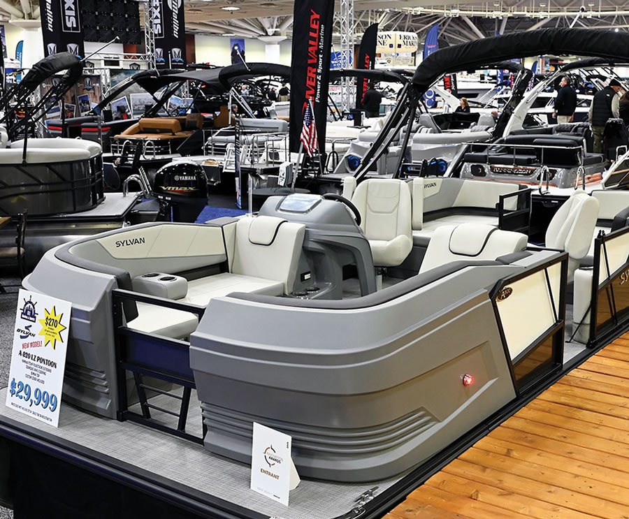 wide quarter view of a silver Sylvan pontoon on display
