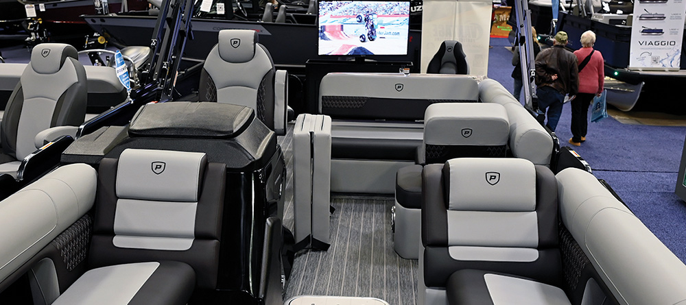 view from the bow of a black and gray Premier Solaris RS Rear Social pontoon on display