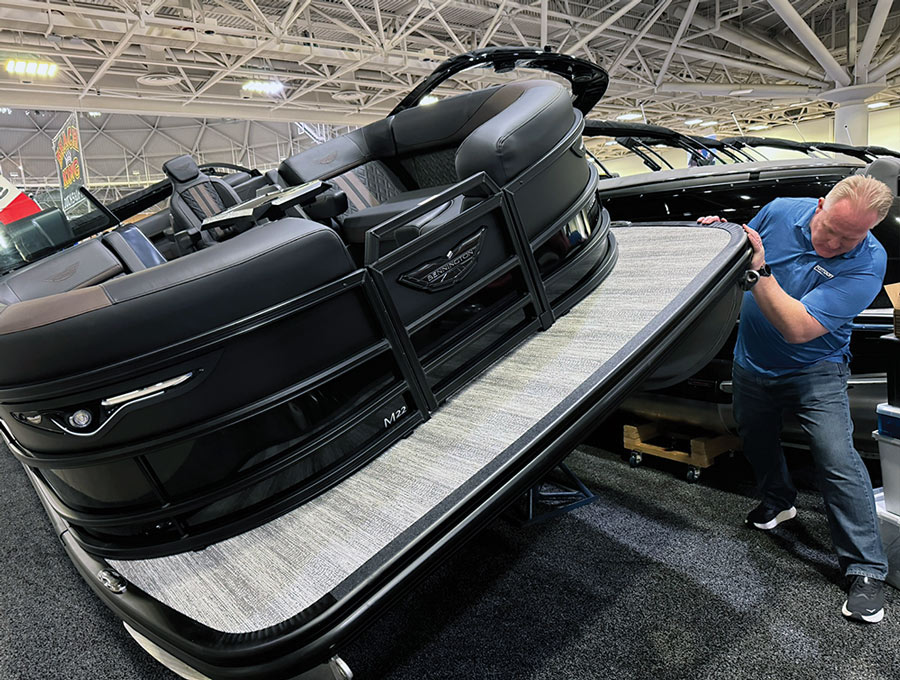Judge Brady Kay surveys a pontoon at the NMMA Innovation Awards