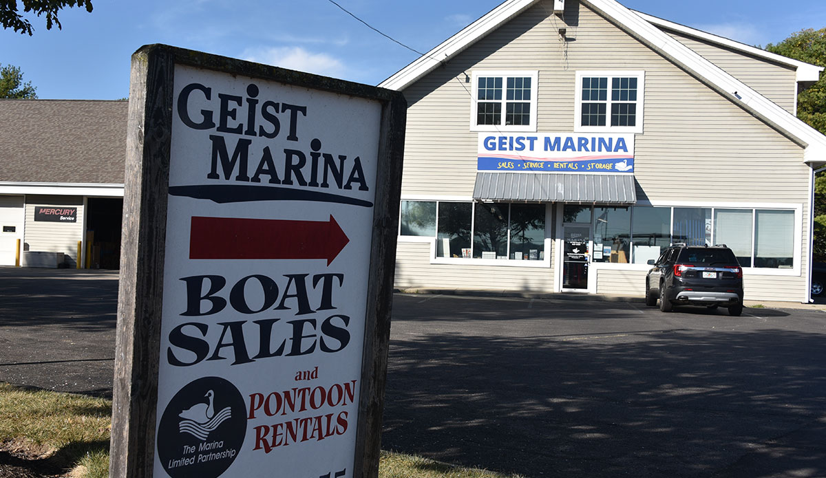 closeup of Geist Marina sign with the Geist Marina storefront in the background 