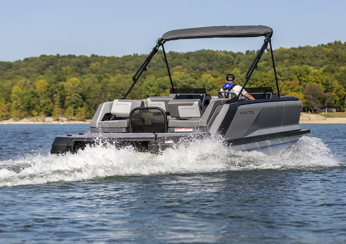 rear view of a Manitou pontoon cruising through the water