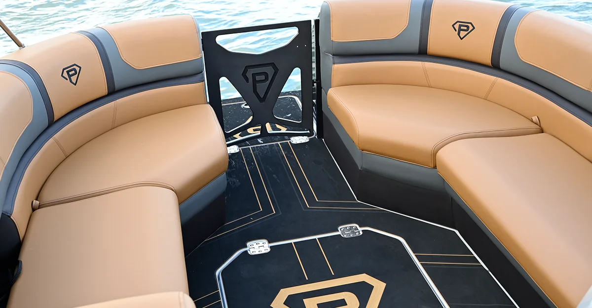 tan seats in a pontoon with the Paradigm logo on it
