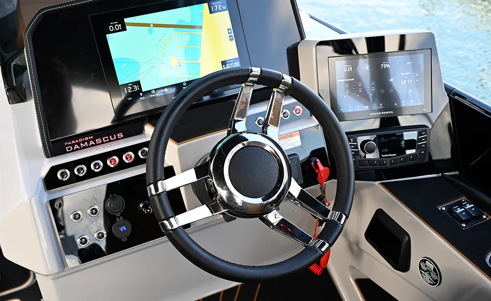 close up of steering wheel and dashboard on a pontoon