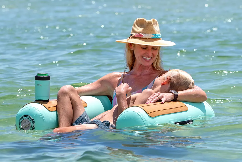 woman with her son floating in a BOTE sling chair