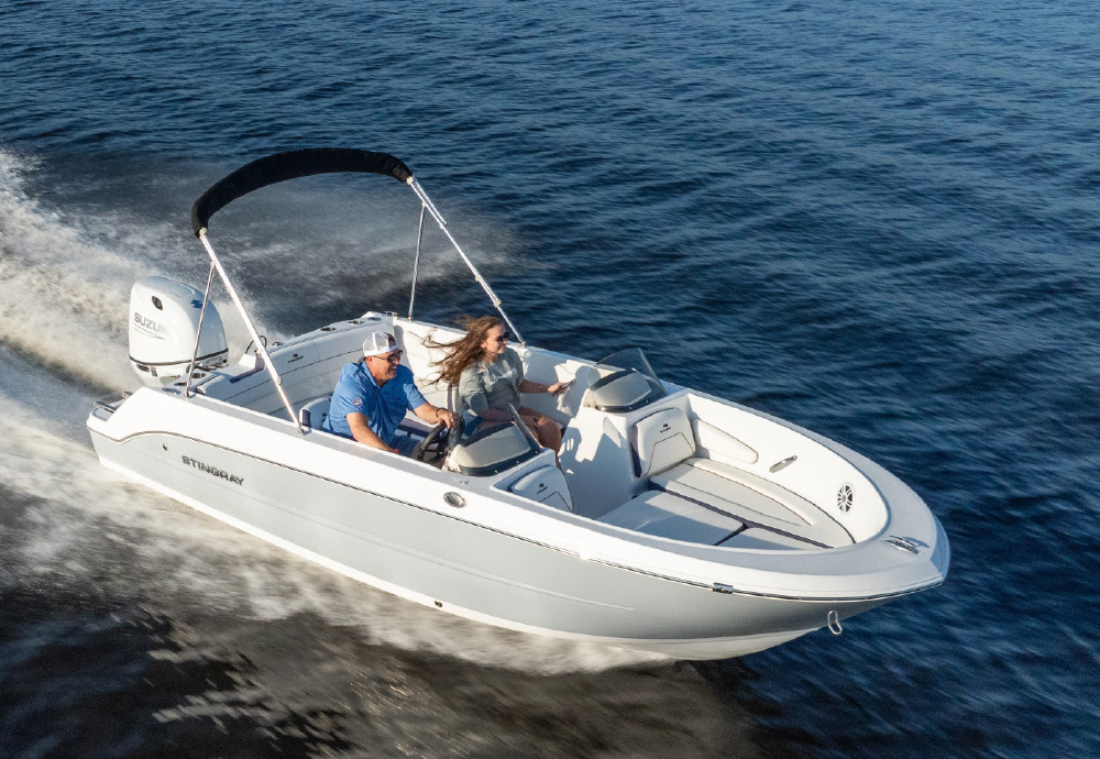 aerial view of man and woman smiling while riding in Stingray 172DC Dual Console pontoon